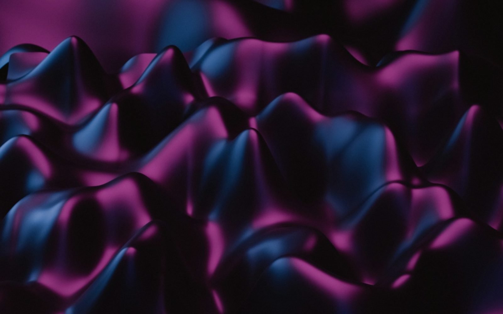 Superficie ondulada en tonos magenta y azul oscuro